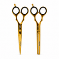 KIT TIJERA DE CORTE Y TIJERA DE PULIR JAGUAR DORADA sobre fondo blanco